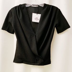 Black blouse.